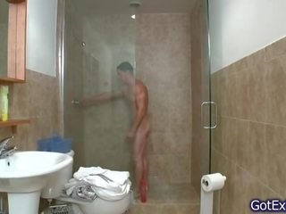 Stupendous muscled lad jerking under shower